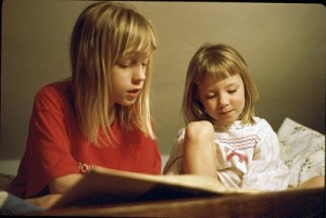 That's me on the left, reading to my little sister, Kylene, on the right.