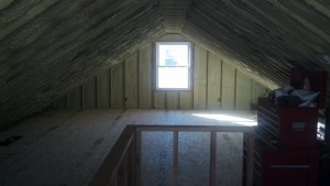 Similar view...now with subfloor, duct work hidden, and a half wall framed out around the staircase.